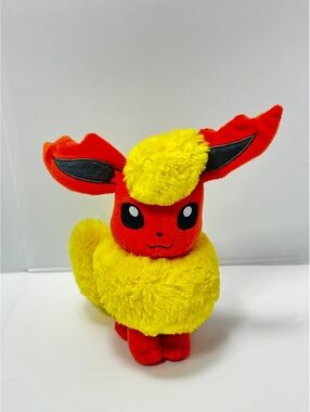 TOMY Pokémon Flareon Plush Toy - Soft, Collectible, Approx. 10 Inches